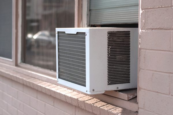 an air conditioning unit in a window, viewed from exterior